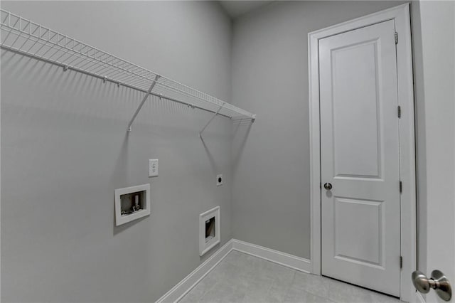 clothes washing area with hookup for a washing machine, baseboards, laundry area, and hookup for an electric dryer