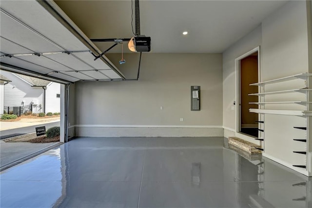 garage featuring a garage door opener and recessed lighting