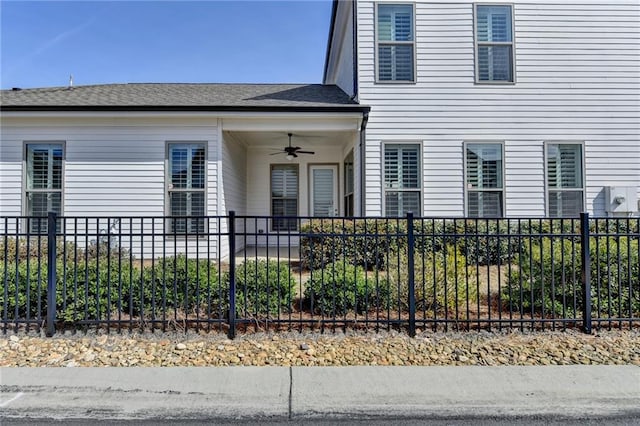 exterior space featuring ceiling fan and fence private yard