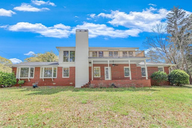 3464 Maynard Cir, Gainesville, GA 30506 - back of property with a ceiling fan, a yard, brick siding, and a chimney