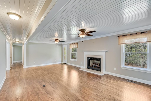 3464 Maynard Cir, Gainesville, GA 30506 - unfurnished living room with crown molding, a fireplace with raised hearth, light wood finished floors, and ceiling fan