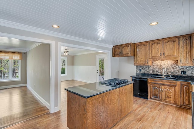 3464 Maynard Cir, Gainesville, GA 30506 - kitchen with black dishwasher, dark countertops, ornamental molding, plenty of natural light, and light wood-style flooring