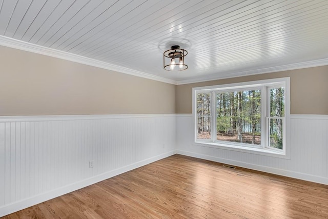 3464 Maynard Cir, Gainesville, GA 30506 - spare room with a wainscoted wall, wood finished floors, and crown molding