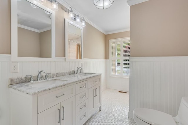 3464 Maynard Cir, Gainesville, GA 30506 - full bath featuring wainscoting, double vanity, crown molding, and tile patterned floors