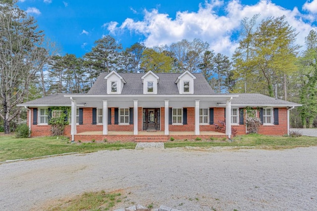 3464 Maynard Cir, Gainesville, GA 30506 - cape cod-style house featuring brick siding, a porch, and a front yard