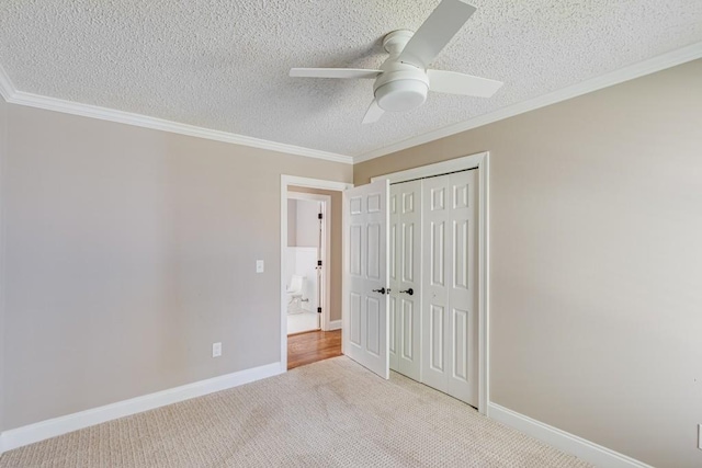 3464 Maynard Cir, Gainesville, GA 30506 - unfurnished bedroom with a closet, ornamental molding, carpet, a textured ceiling, and a ceiling fan