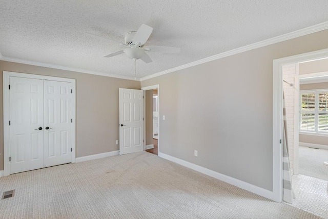 3464 Maynard Cir, Gainesville, GA 30506 - unfurnished bedroom featuring carpet flooring, ornamental molding, a closet, a textured ceiling, and ceiling fan