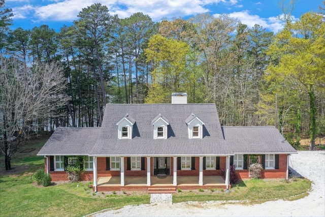 3464 Maynard Cir, Gainesville, GA 30506 - cape cod house featuring covered porch, a chimney, brick siding, and a front yard