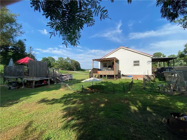 view of yard with a wooden deck