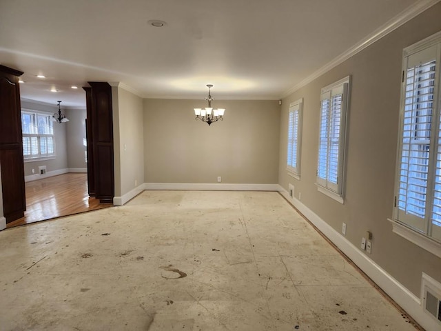 unfurnished dining area with a chandelier and ornamental molding