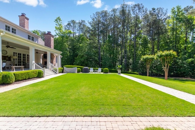 view of yard featuring ceiling fan