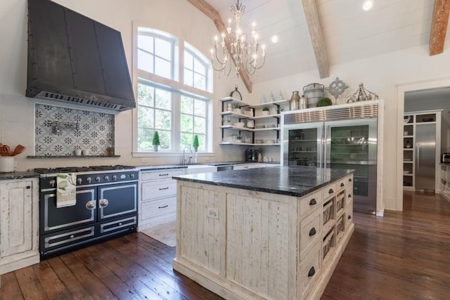 kitchen featuring a center island, tasteful backsplash, vaulted ceiling with beams, dark hardwood / wood-style flooring, and ventilation hood