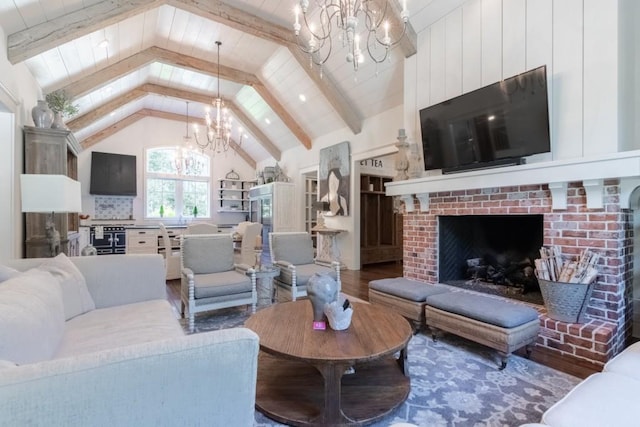 living room with beam ceiling, an inviting chandelier, high vaulted ceiling, wood-type flooring, and a fireplace