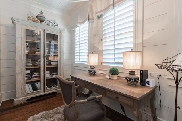 home office with dark hardwood / wood-style floors and crown molding