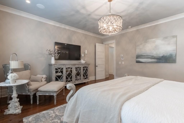 bedroom with crown molding, hardwood / wood-style floors, and an inviting chandelier