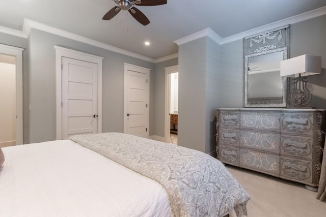 carpeted bedroom featuring ceiling fan and crown molding