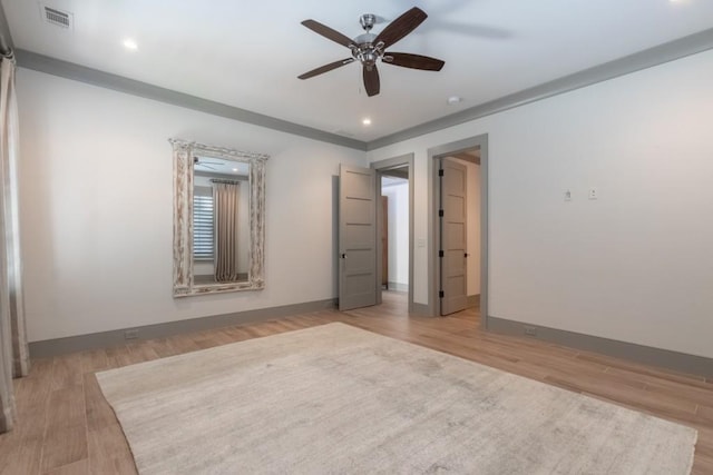 unfurnished bedroom featuring ceiling fan and light wood-type flooring