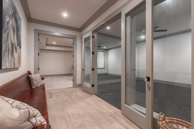 bathroom featuring ceiling fan, wood-type flooring, and french doors