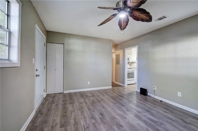 spare room with ceiling fan and hardwood / wood-style flooring