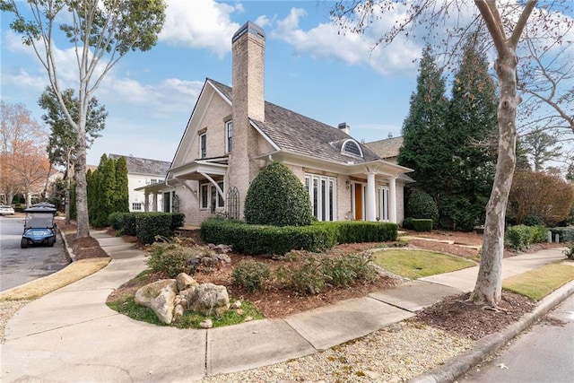 view of side of property with a chimney