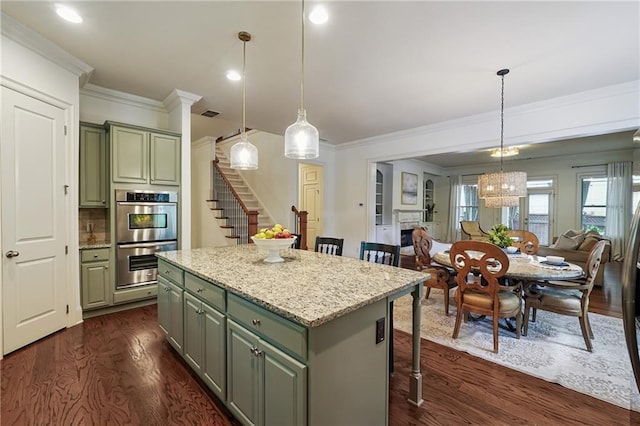 715 Saybeck Way, Milton, GA 30004 - kitchen featuring stainless steel double oven, dark wood finished floors, green cabinetry, ornamental molding, and recessed lighting