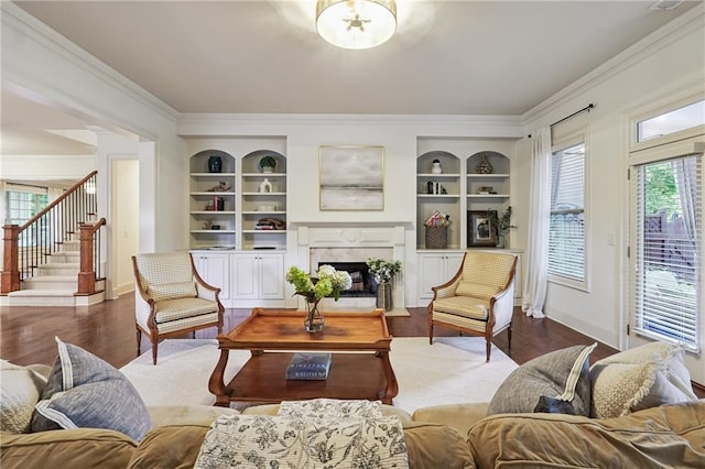 715 Saybeck Way, Milton, GA 30004 - living area with a fireplace, crown molding, stairs, built in features, and plenty of natural light
