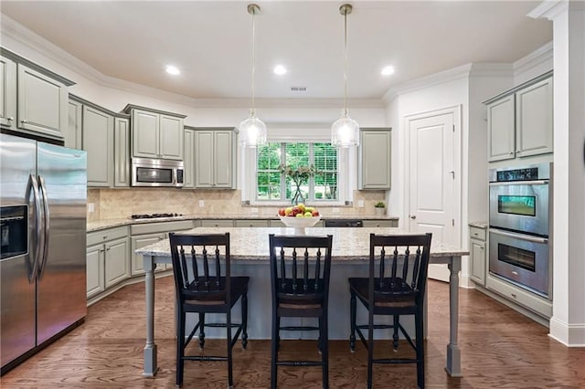 715 Saybeck Way, Milton, GA 30004 - kitchen featuring stainless steel appliances, gray cabinetry, a kitchen island, a kitchen bar, and ornamental molding