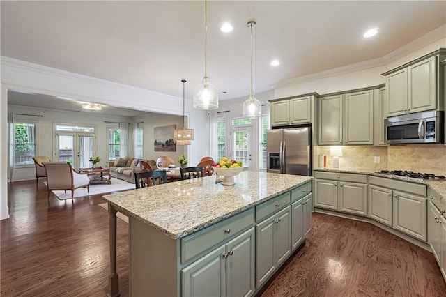 715 Saybeck Way, Milton, GA 30004 - kitchen with stainless steel appliances, dark wood-type flooring, open floor plan, a kitchen island, and a kitchen bar