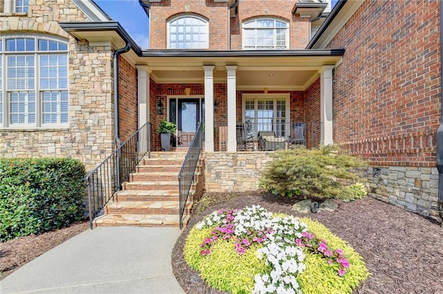 entrance to property featuring a porch