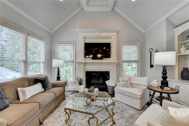 living room with lofted ceiling, light hardwood / wood-style flooring, ornamental molding, and a premium fireplace