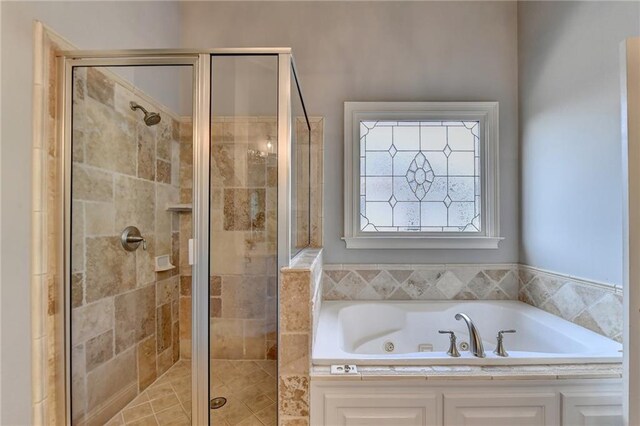 bathroom with shower with separate bathtub