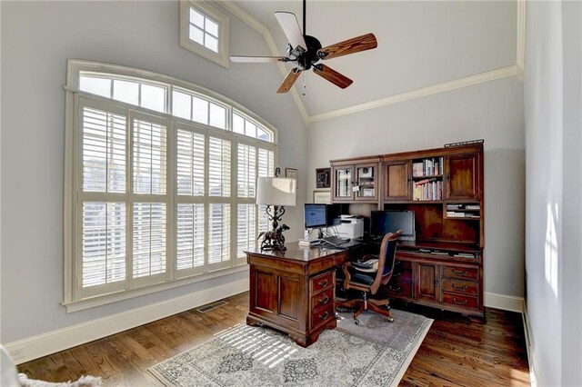 office featuring dark hardwood / wood-style flooring, ceiling fan, plenty of natural light, and lofted ceiling