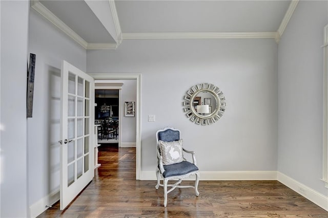 living area featuring french doors, dark hardwood / wood-style flooring, and crown molding