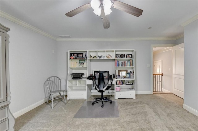 carpeted office with crown molding and ceiling fan