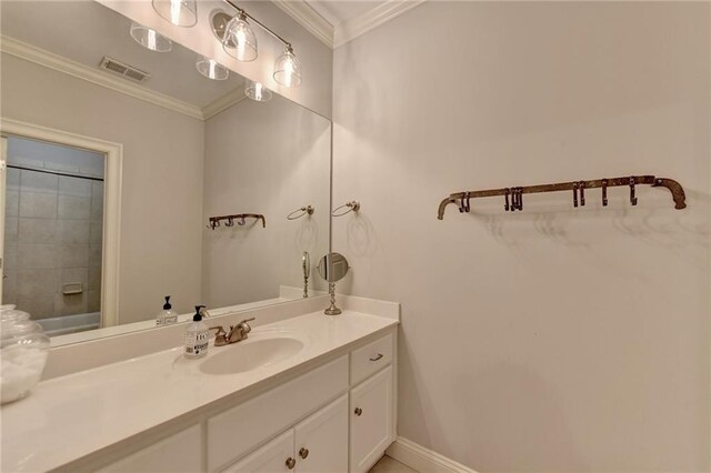 bathroom with vanity and crown molding