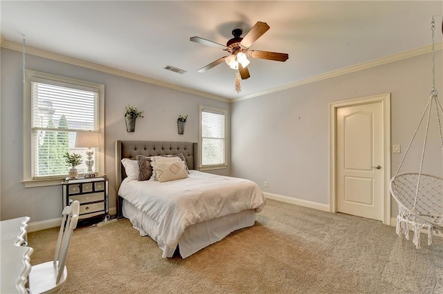 carpeted bedroom with multiple windows, ceiling fan, and crown molding