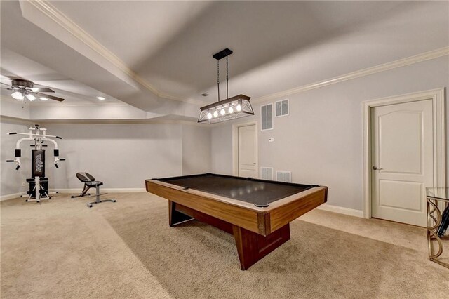 rec room featuring ceiling fan, billiards, a tray ceiling, light carpet, and ornamental molding