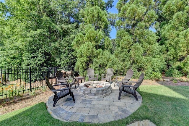 view of patio / terrace with an outdoor fire pit