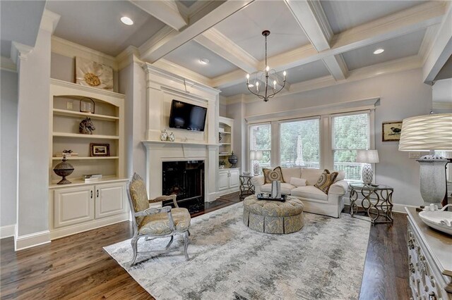 living room featuring dark wood-type flooring, an inviting chandelier, coffered ceiling, built in shelves, and beam ceiling