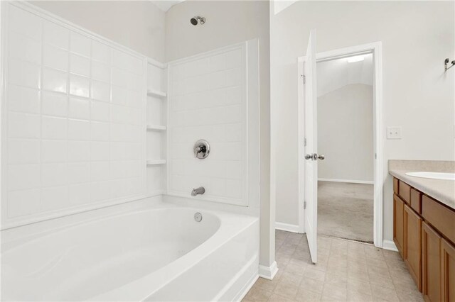 bathroom with bathtub / shower combination and vanity