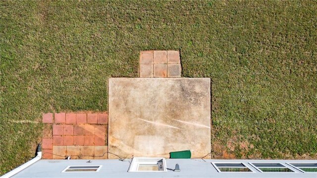 back of house featuring a lawn and a fenced backyard