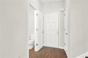 hallway featuring dark wood-style flooring