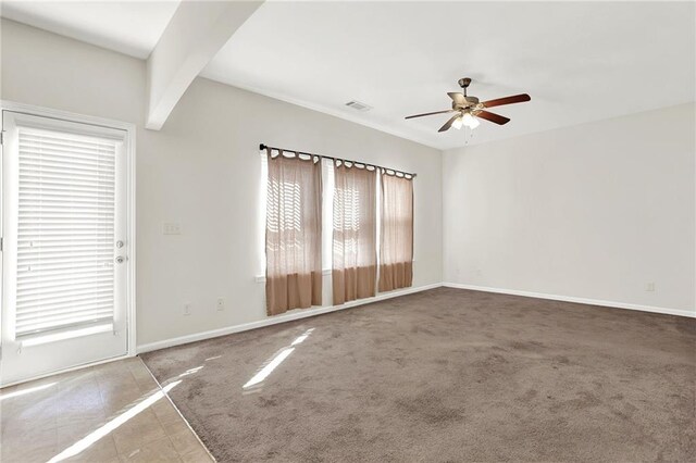 unfurnished room featuring ceiling fan, dark carpet, and baseboards