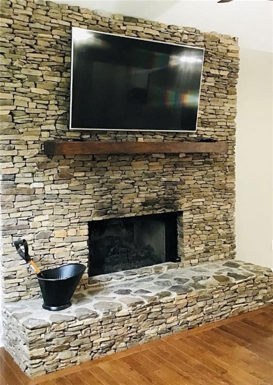 3535 Cameron Cir, Gainesville, GA 30506 - detailed view of wood finished floors and a stone fireplace