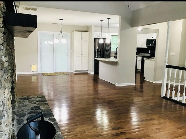 3535 Cameron Cir, Gainesville, GA 30506 - kitchen featuring stainless steel range with electric stovetop, dark wood-style floors, white cabinetry, and decorative light fixtures