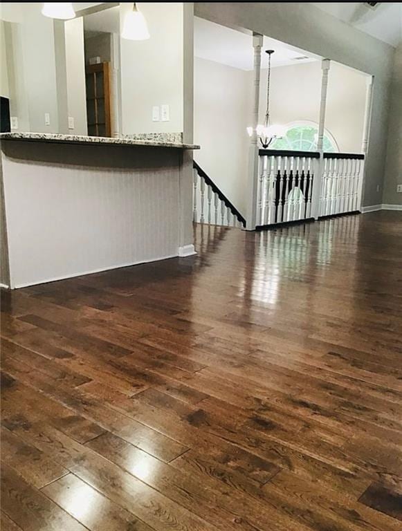 3535 Cameron Cir, Gainesville, GA 30506 - unfurnished living room featuring dark wood finished floors and a chandelier