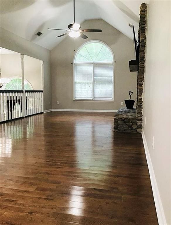 3535 Cameron Cir, Gainesville, GA 30506 - unfurnished living room featuring a ceiling fan, plenty of natural light, wood-type flooring, lofted ceiling, and baseboards