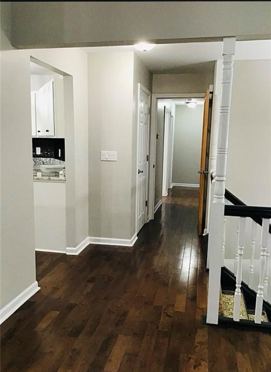 3535 Cameron Cir, Gainesville, GA 30506 - corridor featuring wood-type flooring, baseboards, and an upstairs landing