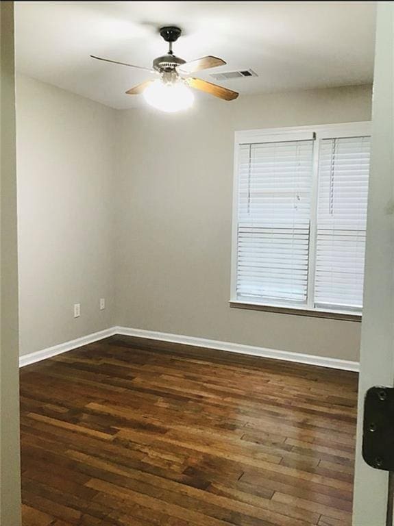 3535 Cameron Cir, Gainesville, GA 30506 - unfurnished room with dark wood finished floors, baseboards, and a ceiling fan
