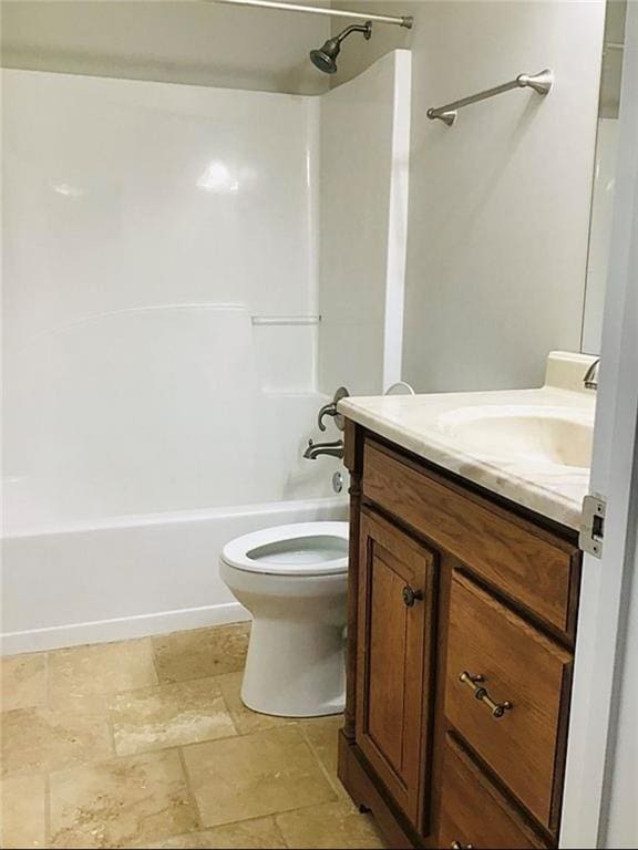 3535 Cameron Cir, Gainesville, GA 30506 - full bath featuring vanity, stone tile floors, shower / tub combination, and toilet